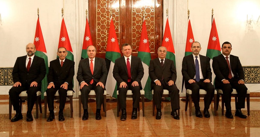His Majesty King Abdullah with Prime Minister Hani Mulki and the newly appointed ministers on Sunday (Photo courtesy of Royal Court)